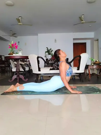 Bhujangasana, or Cobra Pose, is a foundational backbend that strengthens the back and improves spinal flexibility. This guide shows how to practice it safely, keeping the pelvis grounded and shoulders relaxed.