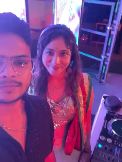A quick selfie with a fellow artist next to the DJ booth during a Dandiya night.