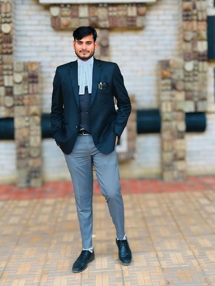 A full-length portrait in my advocate's attire. I believe in acting with purpose and considering every possible action to achieve the best outcome for my client.