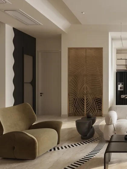 This living area is a celebration of artistic expression, blending diverse materials and sculptural forms. A statement carved-wood screen, a wavy black wall feature, and uniquely shaped furniture come together to create a curated, eclectic space.
