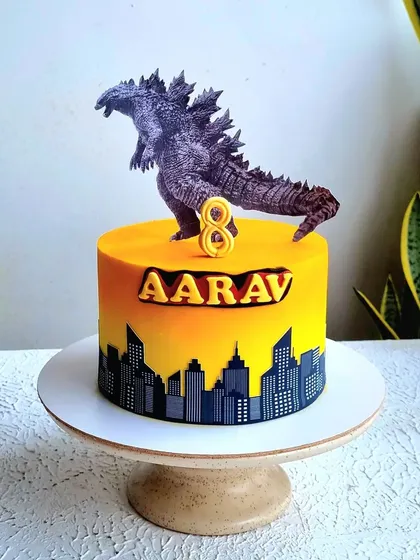 A full view of the Godzilla cake. The dramatic color scheme and iconic monster create a powerful and exciting design.