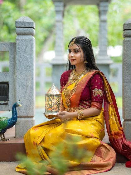 The model with the peacock, a perfect pairing of natural and man-made beauty.