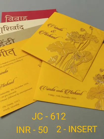 Celebrate with vibrant color using this bright yellow invitation card. The design features embossed golden lotus motifs and includes inserts with beautiful Hindi script for a traditional touch.