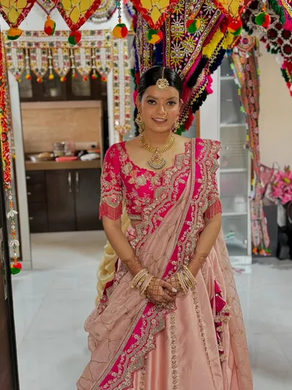 The full look, set against a traditional Gujarati backdrop, perfect for the wedding ceremony.