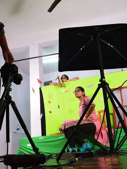 A behind the scenes look at a video shoot. We are using a green screen to create a special effect with our puppets, showing how we blend traditional art with new technology.