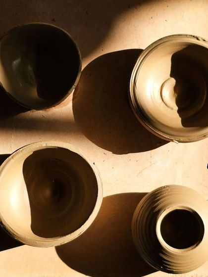 Simple, sun-kissed bowls waiting to be fired. I love how the natural light in my studio plays with the shapes and shadows of the clay pieces.