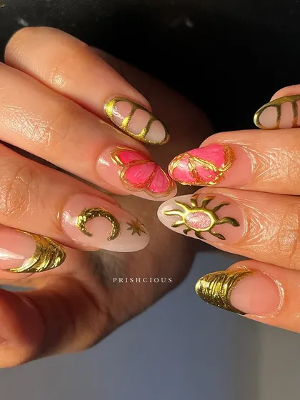 The full view of the pink and gold celestial chrome nails. Each nail tells a little story, with different symbols like butterflies and croissants, all tied together with that stunning gold chrome.