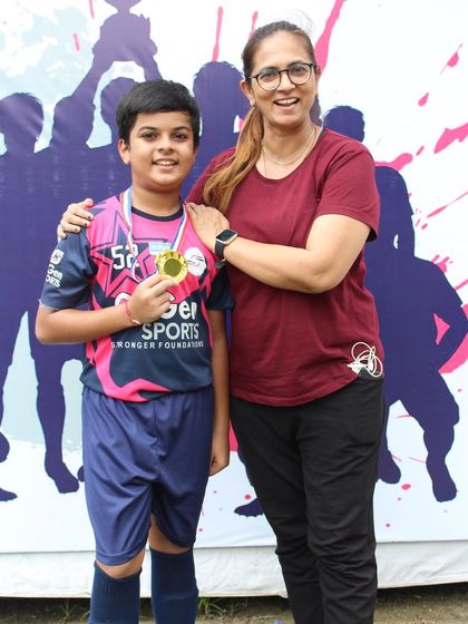 Another top performer from the championship, celebrating his achievement with his mother.