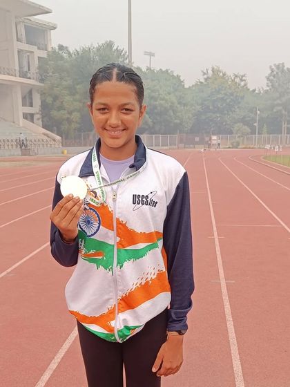 Sanisska proudly holding her medal after a stellar performance at the ISSO National Games.
