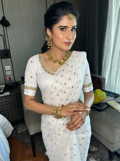 The full Haldi look is a picture of grace and elegance. The makeup is bright and fresh, perfect for this auspicious daytime ceremony.