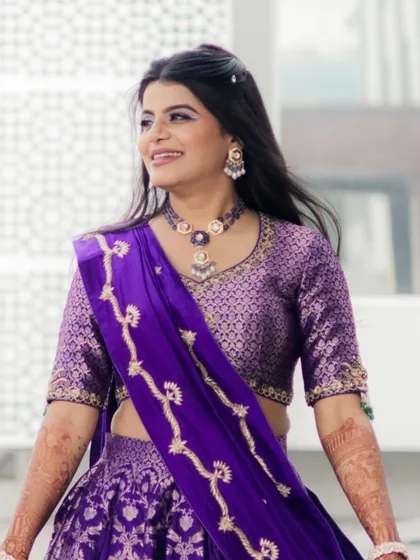 The bride looking radiant and ready for her Haldi. The open hairstyle and fresh makeup are perfect for this daytime event.