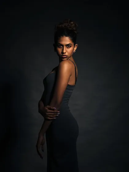 Using shadow to sculpt the body. This portrait emphasizes the model's silhouette and creates a feeling of quiet strength.