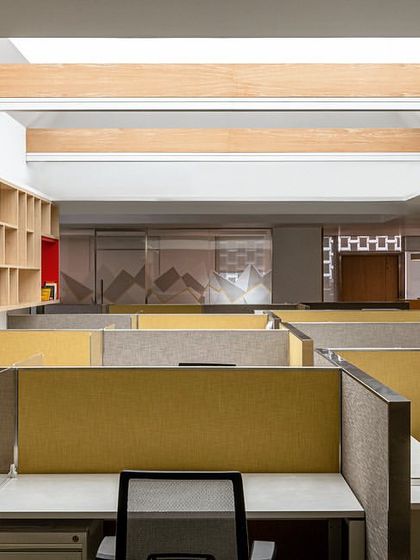 The design studio at the Jindal Stainless Steel office, seen from another angle. The open-plan layout with low partitions encourages collaboration, while the overhead skylight ensures the space is bright and welcoming throughout the day.