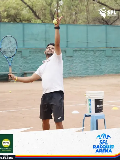 A coach demonstrates the proper serving motion. Our certified coaches lead by example, providing clear, hands-on instruction to help players master every part of the game.