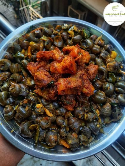 A delicious combination of river snails and pork stir fry. This dish is a favorite for those who love bold and traditional Manipuri flavors.