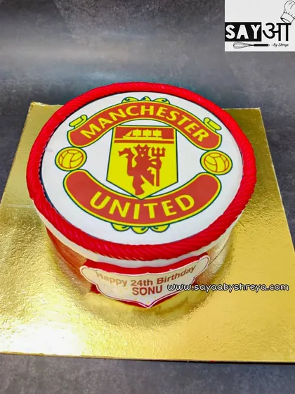 For the Red Devils fans. This cake features a high-quality edible print of the Manchester United football club logo, perfect for celebrating a fan's birthday in style.