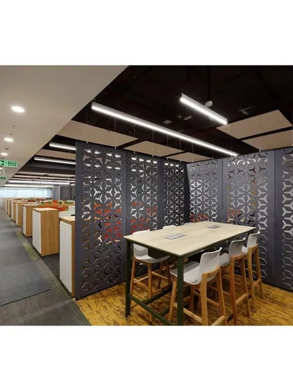 Another view of the collaboration space defined by geometric screens. This angle shows how the space is integrated into the main workflow area, positioned conveniently along a primary circulation path.