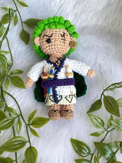 Roronoa Zoro from One Piece in a different outfit. This version features his white kimono, green cape, and of course, his three swords. It's always exciting to create new designs for a character.