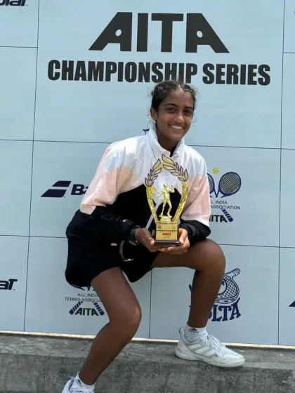 Lucy Roy posing with her winner's trophy after securing the Under-16 singles title at the All India Championship Series in Mumbai.