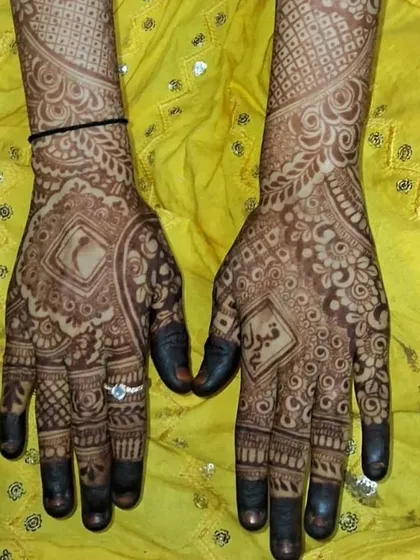 This design features a name written in Urdu script, showing our versatility in different languages and styles to make your mehendi truly personal.