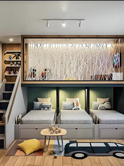 This is one of our favorite projects, a space-saving bedroom designed for three children. We used a multi-level layout with three separate beds, each with its own under-bed storage drawer, and a unique loft play area to maximize floor space for fun and games.