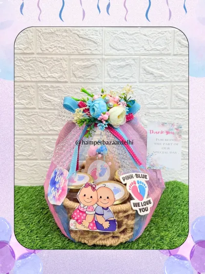 Another take on our twin celebration hamper, this one uses a rustic jute basket and pink and blue ribbons.
