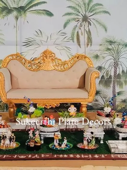 A beautiful engagement setup with a tropical-themed backdrop. I used a variety of handmade dolls representing different cultural scenes to create a unique and narrative display.