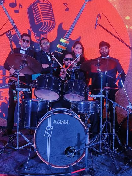A fun picture behind the drum kit after a performance for the State Bank of India.