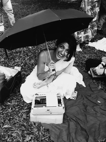 Another view from the rainy day under the umbrella. The joy and laughter are just as present, even when the sun isn't shining. The dedication to sharing love and poetry is an all-weather affair.