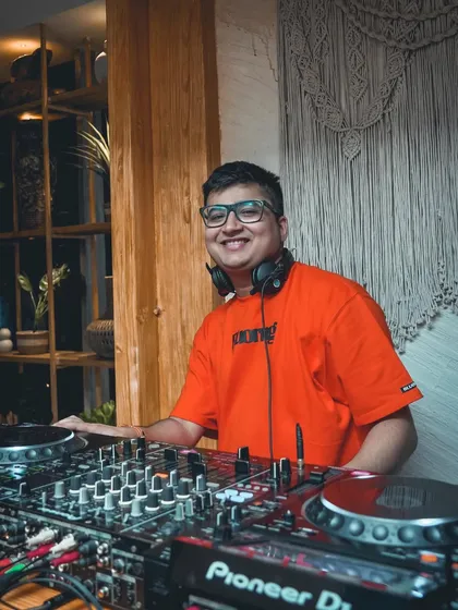 A simple, happy portrait behind the decks. Ready to start the night.