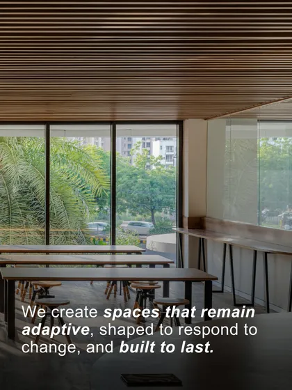 An image of a flexible learning space with a quote overlay emphasizing our commitment. We create spaces that remain adaptive, shaped to respond to change, and built to last.