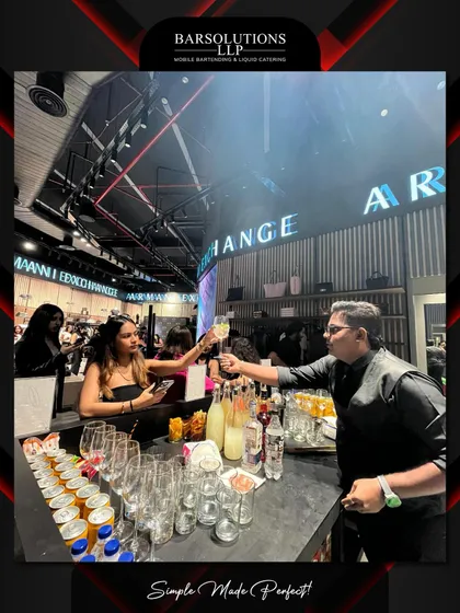 One of our bartenders serving a guest a signature cocktail, showcasing our commitment to engaging and professional service.