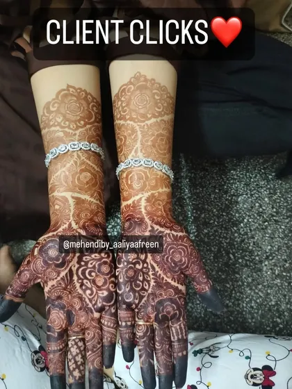 Another happy client photo showcasing the beautiful, dark henna stain.