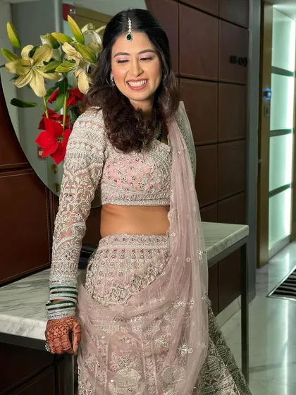 The complete look, showcasing how soft glam makeup pairs beautifully with detailed bridal wear. The focus remains on the bride's radiant face, proving less is often more.
