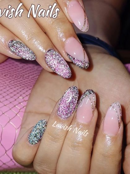 A multi-tonal glitter design on almond nails, creating a sparkling and dynamic effect.