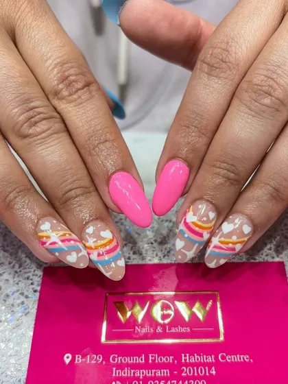 A bright and cheerful rainbow design. This look features a sheer base with colorful stripes and hearts, perfect for spreading joy.