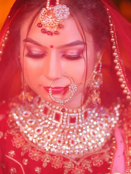 A close-up portrait with a red color cast, creating a moody and artistic feel.