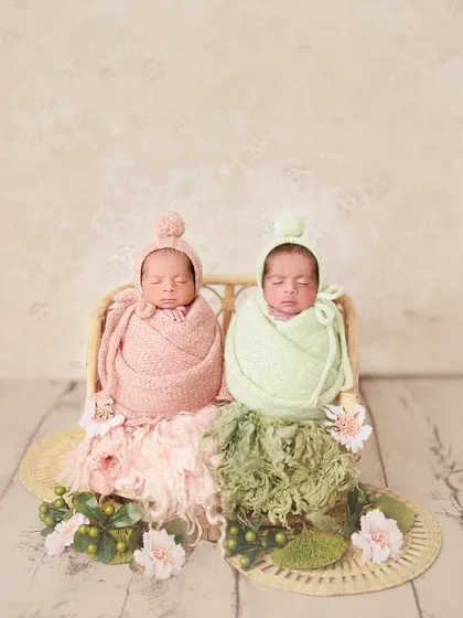 Double the joy, twice the love. It was such a special session capturing these precious newborn twins, a brother and sister, in a coordinated pink and green setup.