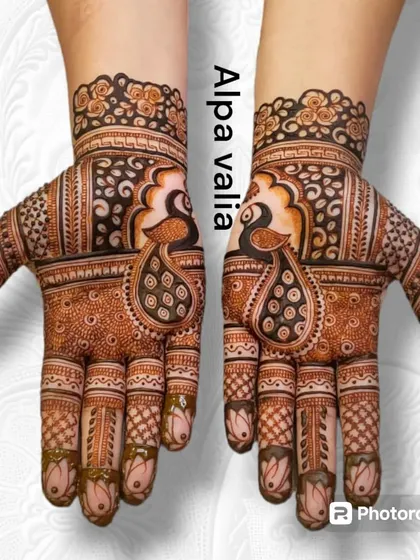 A bold and beautiful peacock design where the bird's form is the main centerpiece on the back of the hand.