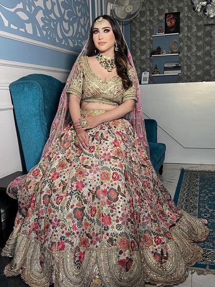 A gorgeous floral embroidered lehenga in a light, creamy base. This is a perfect example of a sophisticated and elegant choice for a day wedding or engagement.