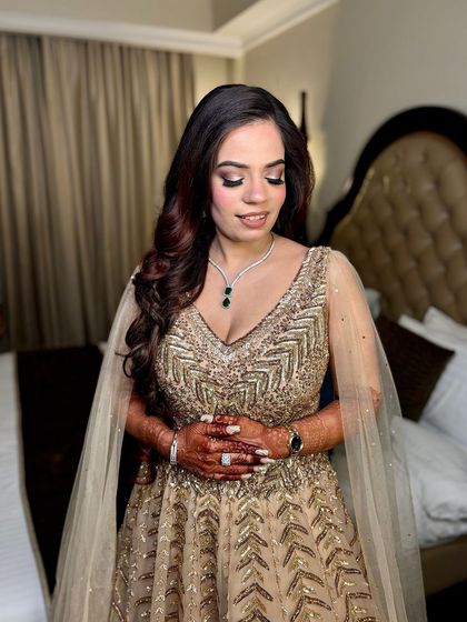 A close-up of Ashima's engagement makeup, with her eyes closed to show the soft, shimmery eyeshadow.