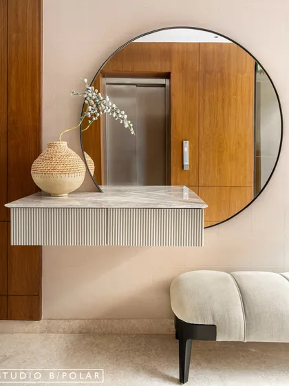 In the transitional spaces of Noor Haus, like hallways and lift lobbies, we used warm wood paneling, sculptural furniture, and curated art to turn these "in-between" zones into beautiful design moments.