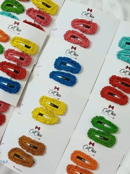 Getting a large order of our crochet barrettes ready. They are a very popular choice for return gifts because they are so colorful and useful.