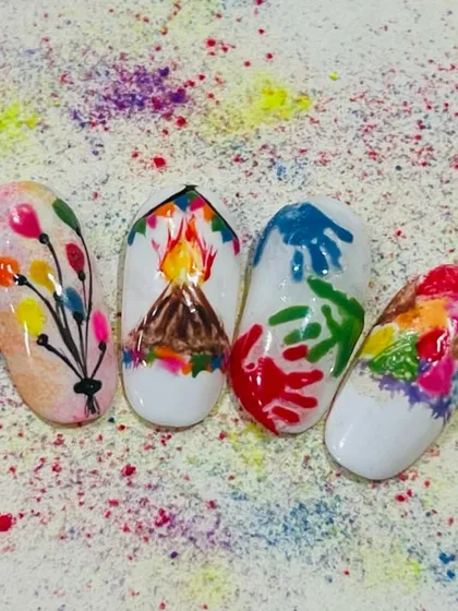 A student's creative take on Holi-themed nail art. They've captured the spirit of the festival with designs of Holika Dahan, colored handprints, and water balloons.