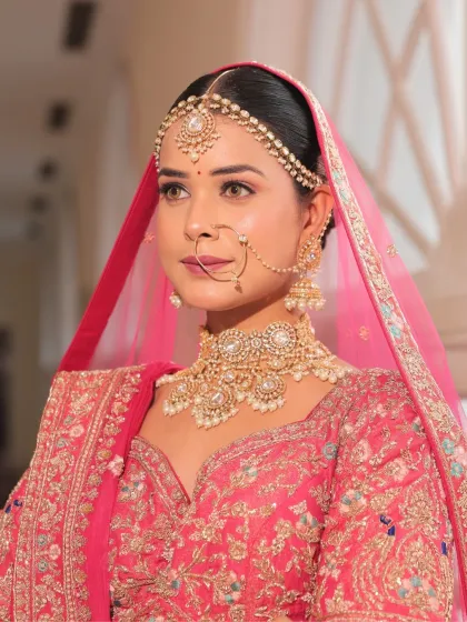 Another beautiful close-up, capturing the bride's serene expression. The makeup is subtle and elegant, enhancing her features beautifully.