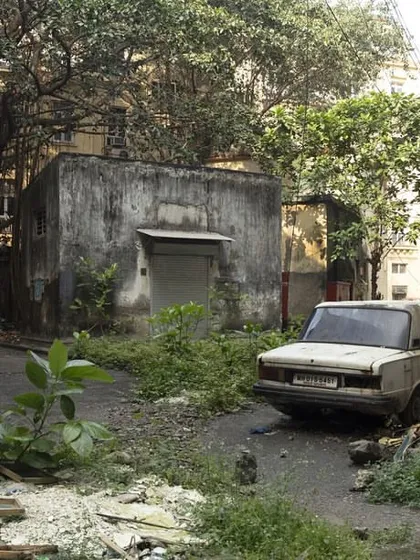 A derelict courtyard in Ballard Estate, currently inaccessible and overgrown. This is the kind of forgotten space that our urban regeneration proposal seeks to bring back to life.