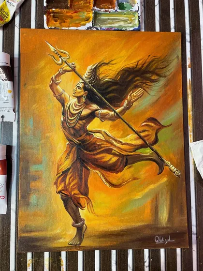 The finished painting of Shiva's cosmic dance, surrounded by my acrylic paints. The warm, energetic colors represent his power.