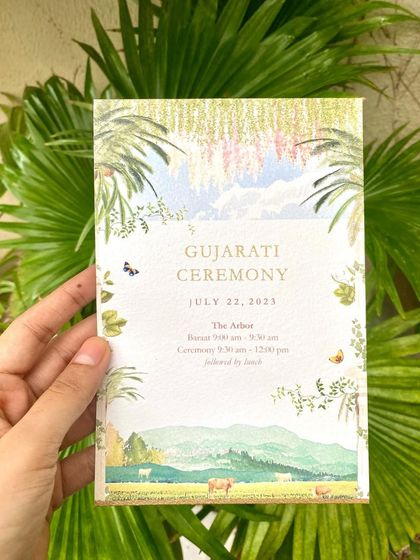 The corresponding Gujarati Ceremony invitation. While the layout is similar, the artwork changes to reflect the specific cultural traditions and decor of this event, featuring butterflies and different florals.
