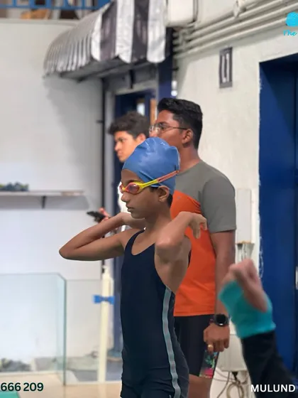 Making waves and memories. A competitor prepares for her race, showcasing the discipline learned in our coaching sessions.