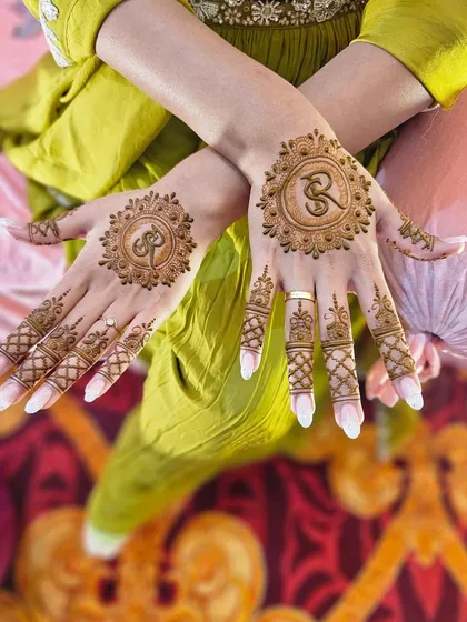 A personalized design for a client featuring their initial 'R' inside a decorative mandala. I can add names, initials, or dates to any mehndi design.